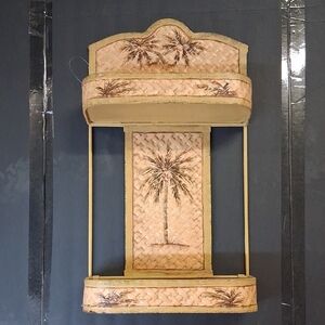Palm tree-themed wall shelf, likely made of metal with a faux-woven Inlay.